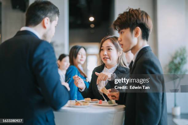 group of multiracial asian business participants casual chat tea break conference event - banquet hall stock pictures, royalty-free photos & images