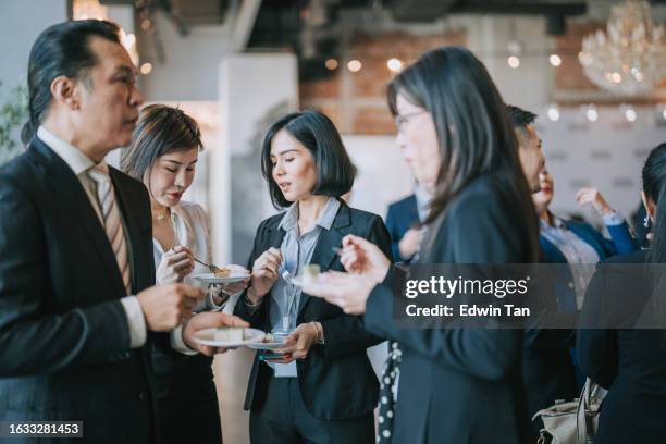 asian multiethnic business people talk during a coffee break in seminar business conference - banquet hall stock pictures, royalty-free photos & images