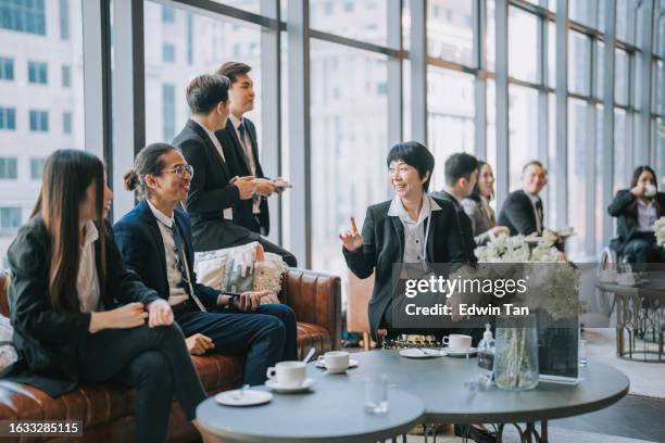 group of multiracial asian business participants casual chat after successful conference event - summit meeting stockfoto's en -beelden