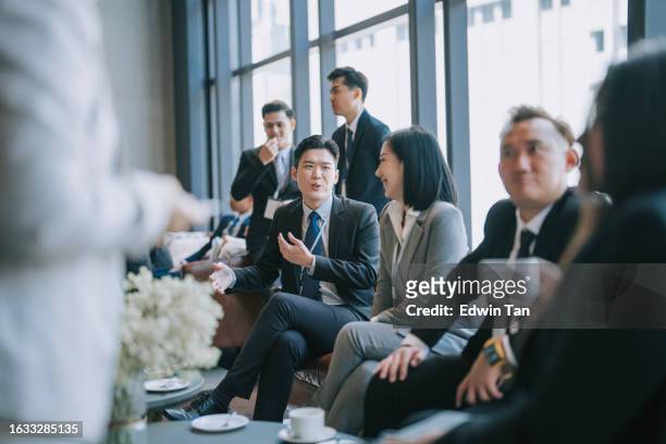 group of multiracial asian business participants casual chat after successful conference event - summit meeting stock pictures, royalty-free photos & images