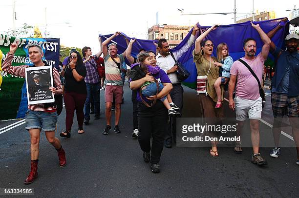 Protesters march down Oxford St during a rally against alleged police brutality at the annual Sydney Gay and Lesbian Mardi Gras parade on March 8,...