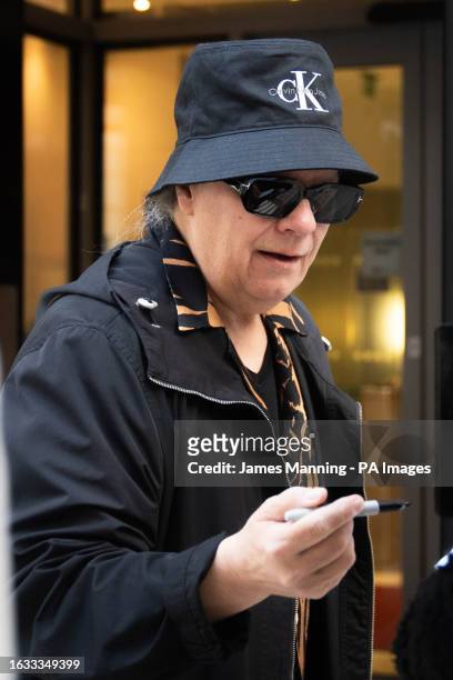 Duran Duran's Andy Taylor signs records as he arrives at Wogan House in central London to appear on the Zoe Ball Breakfast Show on Radio 2. The...