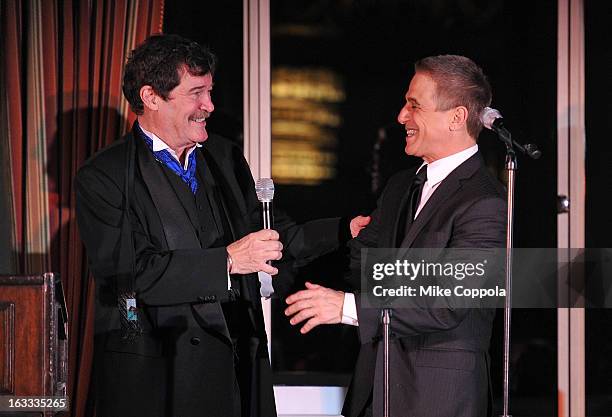 Table 4 Writers Foundation President Josh Gaspero presents an award that actor Tony Danza accepts on Father Peter Colapietro's behalf at the Table 4...