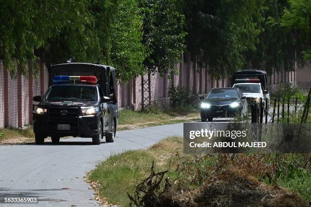 Convoy of vehicles carrying a special court judge Abual Hasnat Muhammad Zulqarnain, leaves from the Attock prison after the case hearing of former...