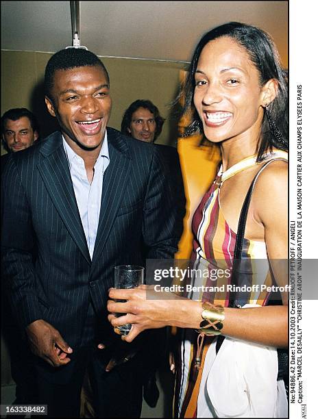 Marcel Desailly "Christine Arron" inauguration of a new shop Cartier at the Champs Elysees in Paris.