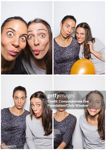 young women pulling faces in photo booth - photo booth picture stock pictures, royalty-free photos & images