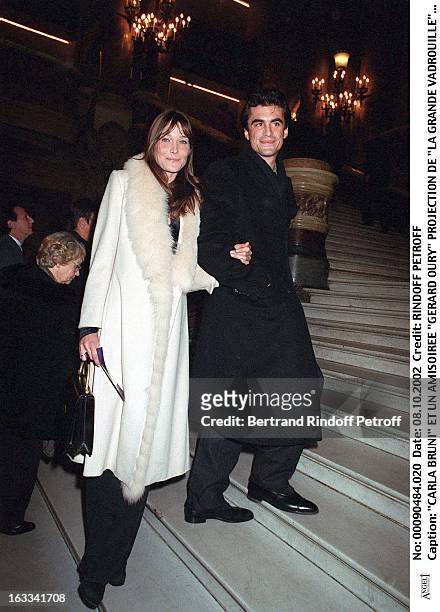 Carla Bruni and her friend Raphael Enthoven "Gerard Oury" film screening of "La Grande Vadrouille" at the Garnier opera.