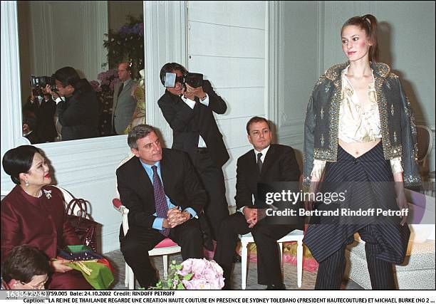 The queen of Thailand look at a haute couture creation besides Sidney Toledano and Michael Burke - queen of Thailand at Dior.