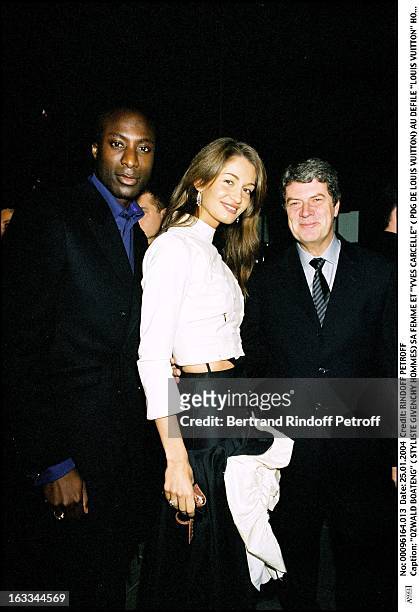 Ozwald Boateng his wife and "Yves Carcelle" at the Louis Vuitton ready to wear fashion show fall winter 2004-2005 stylist: Mark Jacobs".