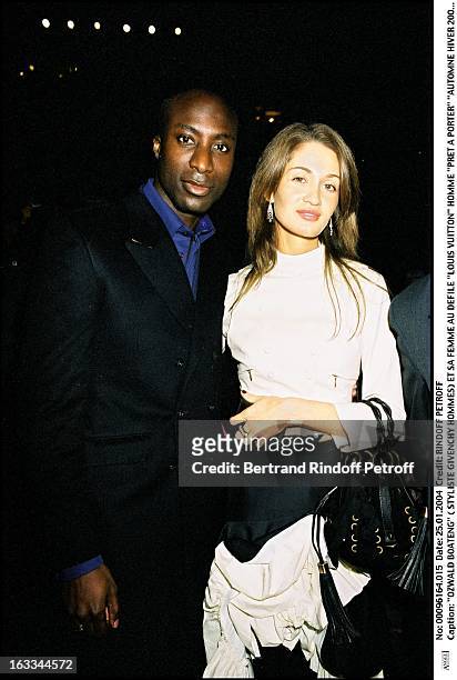Ozwald Boateng and his wife at the Louis Vuitton ready to wear fashion show fall winter 2004-2005 stylist: Mark Jacobs".