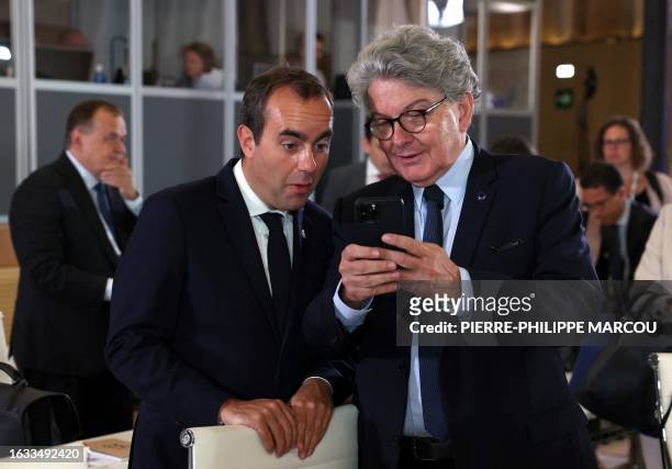 French Defence Minister Sebastien Lecornu chats with European Commissioner Thierry Breton during an informal meeting of EU defence ministers held in...