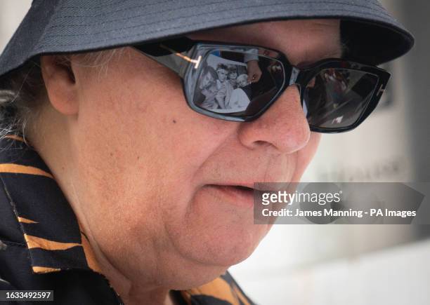 Members of Duran Duran are reflected in the glasses of Andy Taylor, as he leaves Wogan House in central London, after appearing on the Zoe Ball...
