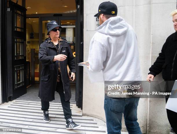 Duran Duran's Andy Taylor greets fans as he leaves Wogan House in central London to appear on the Zoe Ball Breakfast Show on Radio 2. The 62-year-old...