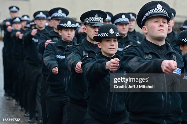 Police recruits participate in a passing out parade at Tulliallan Police College on March 8, 2013 in Tulliallan, Scotland. All eight Police Forces in...