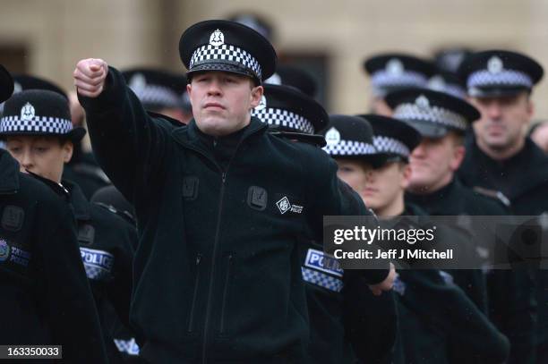 Police recruits participate in a passing out parade at Tulliallan Police College on March 8, 2013 in Tulliallan, Scotland. All eight Police Forces in...