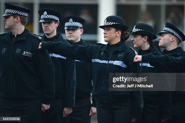 Police recruits participate in a passing out parade at Tulliallan Police College on March 8, 2013 in Tulliallan, Scotland. All eight Police Forces in...