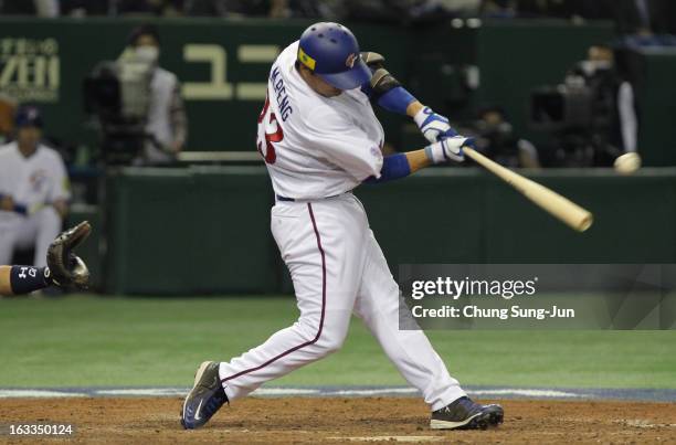Cheng-Min Peng of Chinese Taipei hits a RBI single in the fifth inning during the World Baseball Classic Second Round Pool 1 game between Japan and...