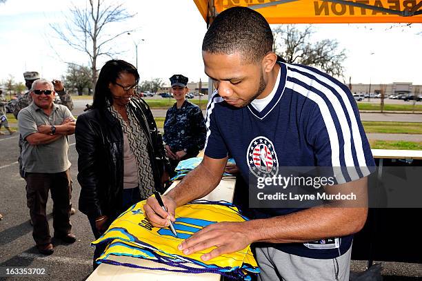 Eric Gordon of the New Orleans Hornets meets with local military personnel thanking them for their service on March 7, 2013 at the Joint Reserve Base...