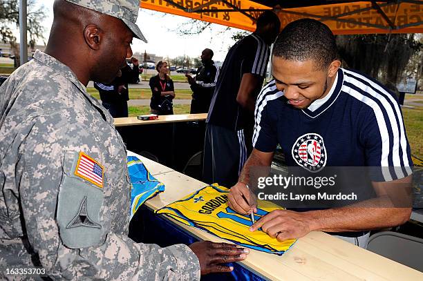 Eric Gordon of the New Orleans Hornets meets with local military personnel thanking them for their service on March 7, 2013 at the Joint Reserve Base...