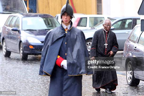 Nigerian Cardinal Francis Arinze leaves the Paul VI Hall at the end of the seventh general congregation on March 8, 2013 in Vatican City, Vatican....