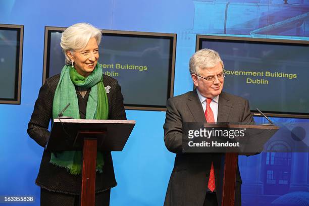 In this handout image provided by Justin MacInnes, International Monetary Fund Managing Director Christine Lagarde with Tánaiste and Minister for...