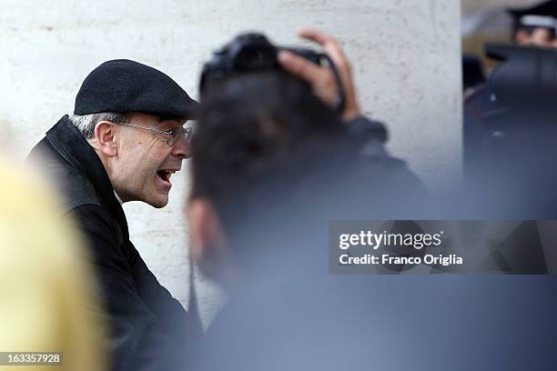 Archbishop of Lione cardinal Philippe Barbarin leaves the Paul VI Hall riding a bike at the end of the seventh general congregation on March 8, 2013...