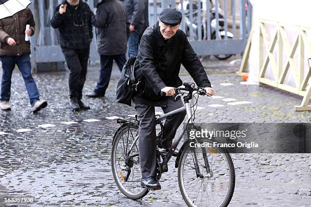 Archbishop of Lione cardinal Philippe Barbarin leaves the Paul VI Hall riding a bike at the end of the seventh general congregation on March 8, 2013...