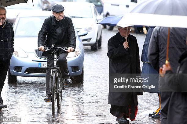 Archbishop of Lione cardinal Philippe Barbarin leaves the Paul VI Hall riding a bike at the end of the seventh general congregation on March 8, 2013...
