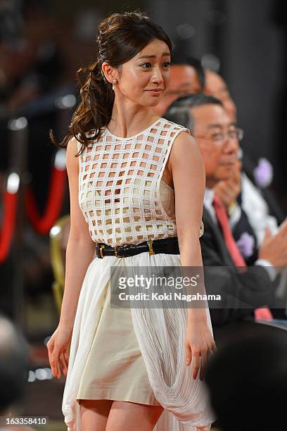 Actress Yuko Oshima walks the red carpet during the 36th Japan Academy Prize Award Ceremony at Grand Prince Hotel Shin Takanawa on March 8, 2013 in...