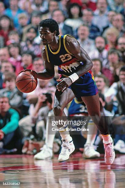 Dunn of the Denver Nuggets dribbles the ball against the Portland Trail Blazers during a game played circa 1986 at the Veterans Memorial Coliseum in...