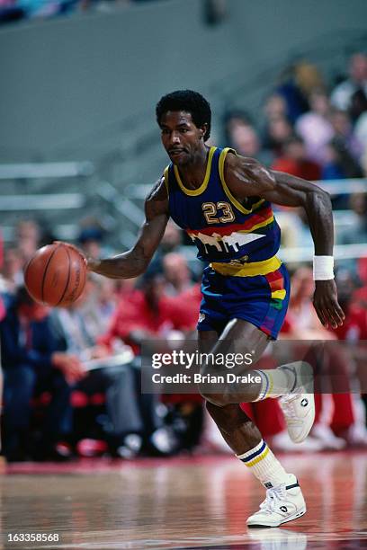 Dunn of the Denver Nuggets dribbles the ball against the Portland Trail Blazers during a game played circa 1986 at the Veterans Memorial Coliseum in...