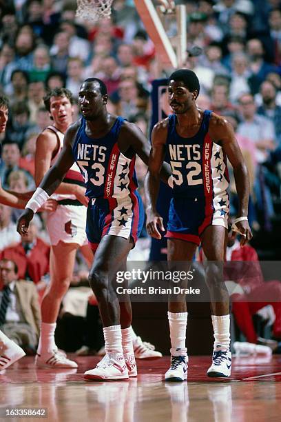 Buck Williams and Darryl Dawkins of the New Jersey Nets defend against the Portland Trail Blazers during a game played in 1986 at the Veterans...