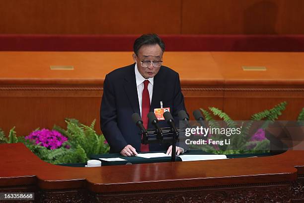 Wu Bangguo , outgoing Chairman of the National People's Congress, delivers the work report during a plenary session of the NPC held in Beijing's...