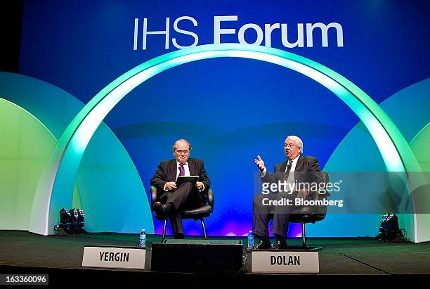 Michael Dolan, senior vice president of ExxonMobil Corp., right, speaks while Daniel Yergin, chairman of IHS Cambridge Energy Research Associates...