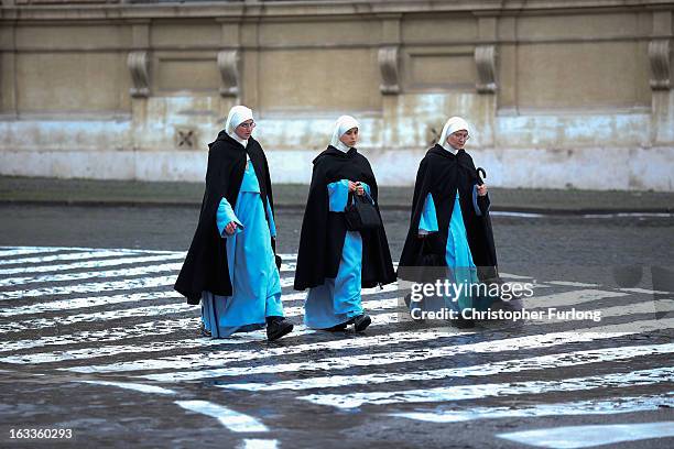 Three nuns walk to the Vatican on March 8, 2013 in Vatican City, Vatican. Cardinals are set to enter the conclave to elect a successor to Pope...