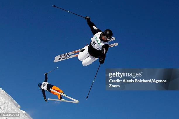 Philippe Marquis of Canada and Ville Miettunen of Finland compete during the FIS Freestyle Ski World Championship Men's and Women's Dual Moguls on...