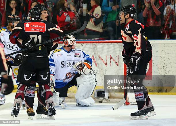 Ivan Ciernik of Hannover celebrate with his team mates his team's 1st goal during the DEL match between Hannover Scorpions and Straubing Tigers at...