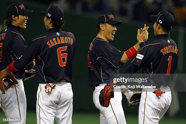 Outfielder Takashi Toritani , Seiichi Uchikawa , Hayato Sakamoto and Yoshio Itoi of Japan celebrate after winning the World Baseball Classic Second...