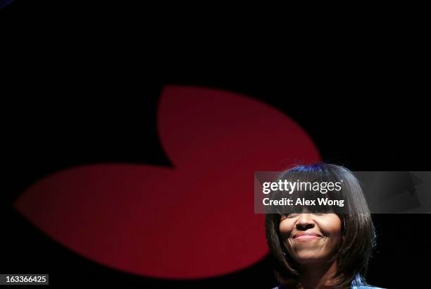 First lady Michelle Obama speaks during the "Building a Healthier Future Summit" March 8, 2013 at the Lisner Auditorium of George Washington...