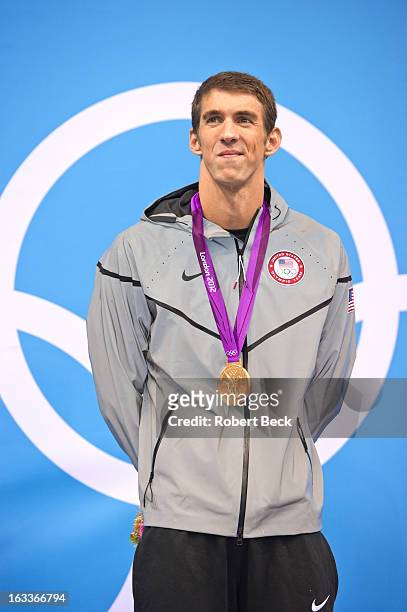 Summer Olympics: USA Michael Phelps victorious on stand after winning Men's 200M Individual Medley Final gold medal at Aquatics Centre. London,...