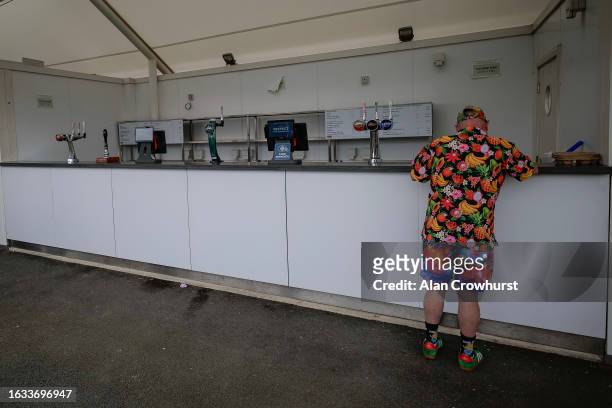 Racegoers planing his bet at York Racecourse on August 23, 2023 in York, England.
