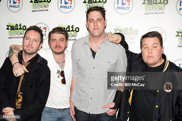 Tim Brennan, Jeff DaRosa, James Lynch and Ken Casey of Dropkick Murphys pose at Radio Station Q102 iHeartRadio Performance Theater March 8, 2013 in...