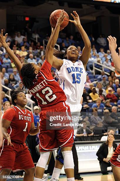 Richa Jackson of the Duke Blue Devils puts up a shot against Krystal Barrett of the North Carolina State Wolfpack during the quarterfinals of the...