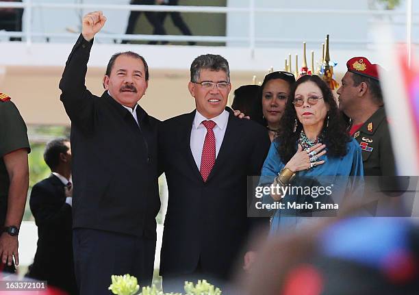 Nicaragua's President Daniel Ortega, Venezuela's Foreign Minister Elias Jaua and Ortega's wife Rosario Murillo stand before entering the funeral for...