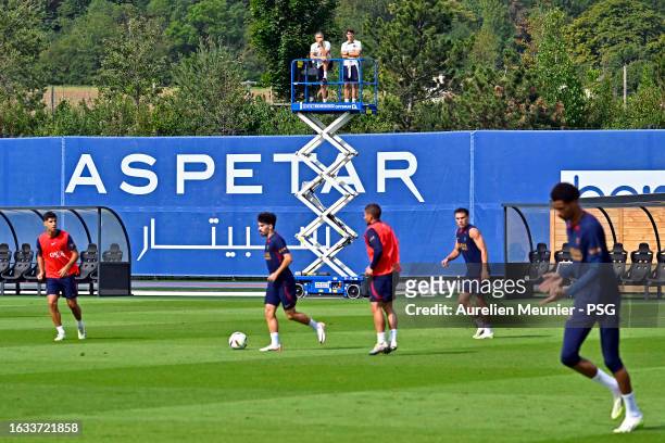 Luis Enrique watches players from a crane during a Paris Saint-Germain training session at Campus PSG on August 23, 2023 in Paris, France.