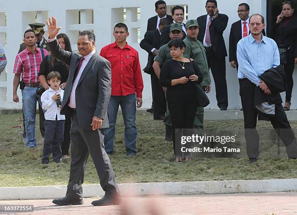 Rev. Jesse Jackson waves to the crowd while departing the funeral for Venezuelan President Hugo Chavez at the Military Academy on March 8, 2013 in...