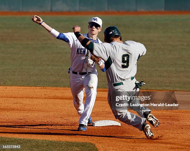 Kentucky second baseman J.T. Riddle forces Michigan State's Jimmy Pickens at second base on the front end of an inning-ending double play in the...