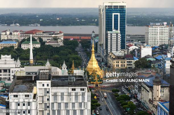 This general view shows residential and commercial buildings in Yangon on August 30, 2023.