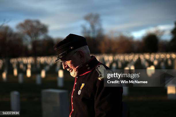 Civil War enthusiast Andrew Johnson walks through Arlington National Cemetery following a burial service for two unknown sailors who were killed in...