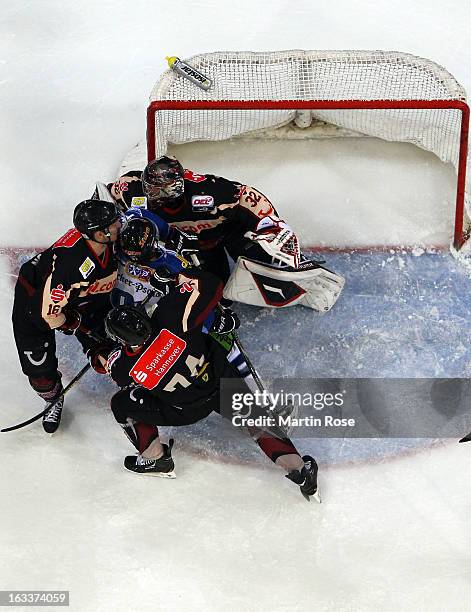 Dimitri Paetzold , goaltender of Hannover saves the shot of Rene Roethke of Straubing in front of the net during the DEL match between Hannover...